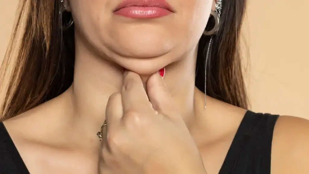 An image of a woman with double chin, sad, worried : Non Surgical Double Chin Removal Treatment in Chippenham, UK